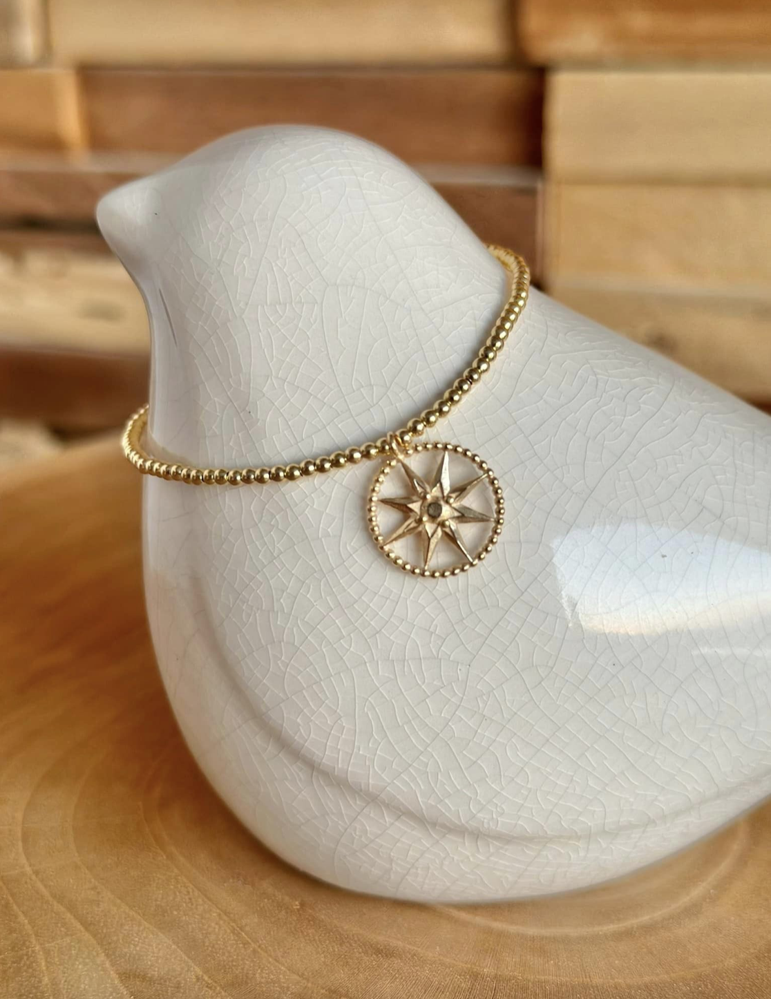 Bracelet or, pendentif rose des vents CD