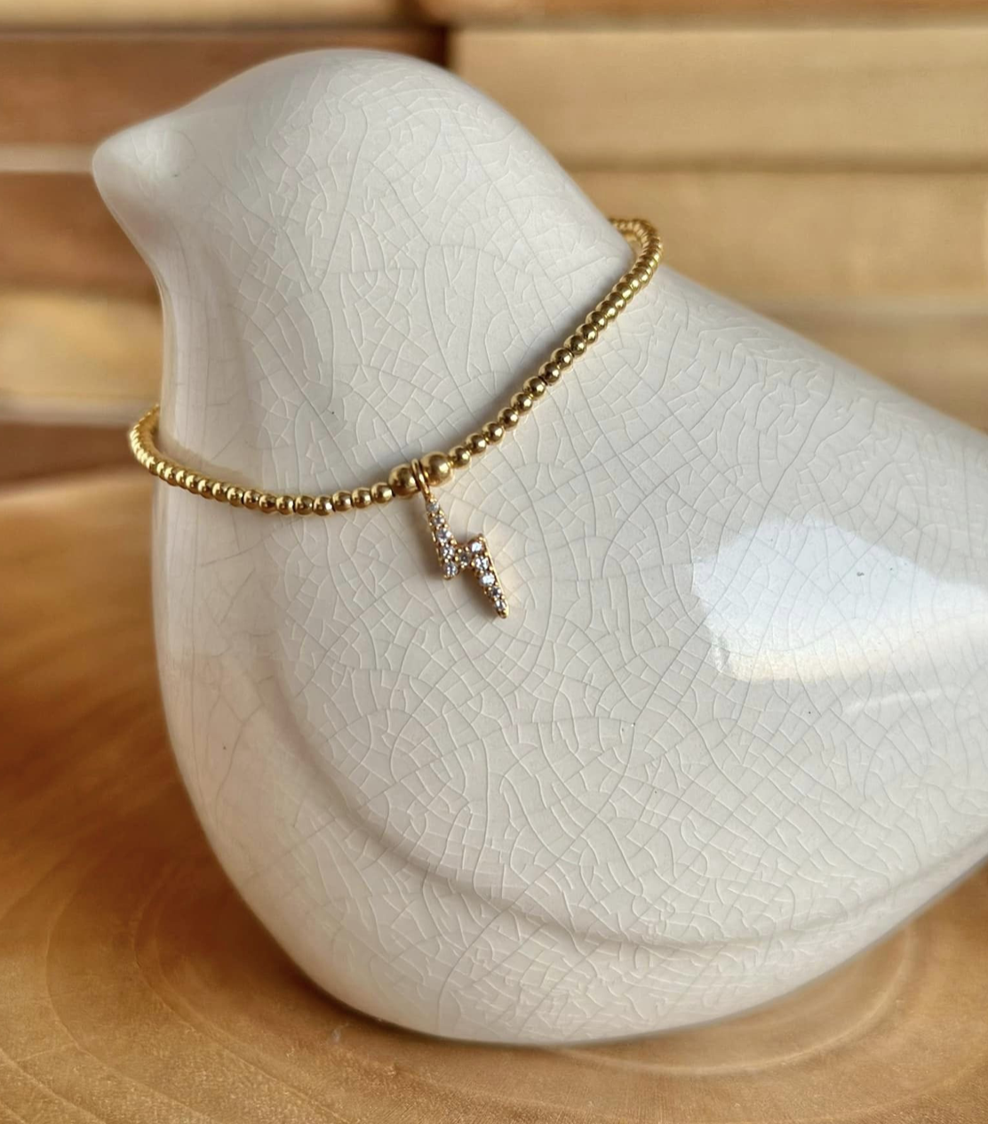 Bracelet or, pendentif eclair / orage avec zirconium