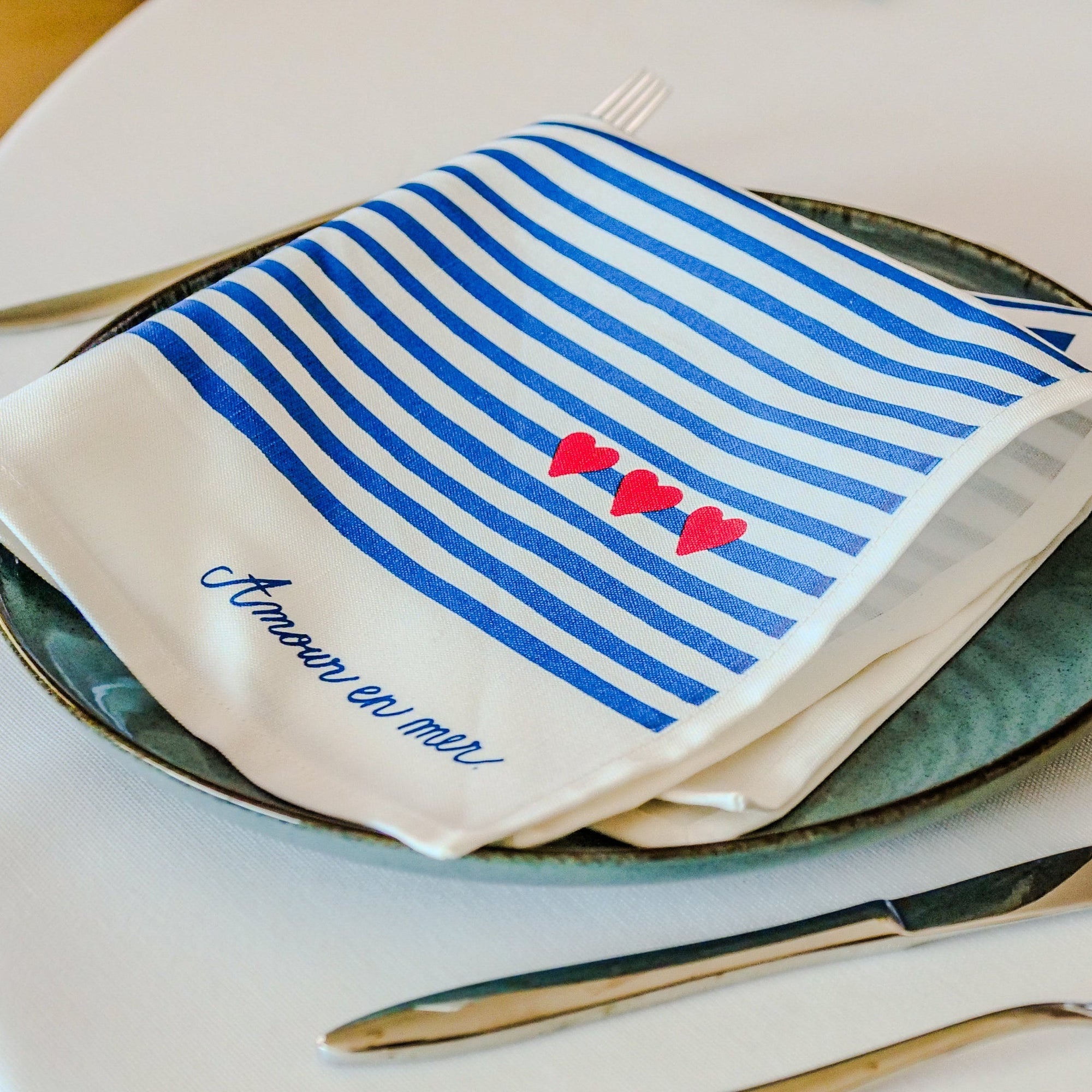 La serviette de table à l'unité "Amour en mer"