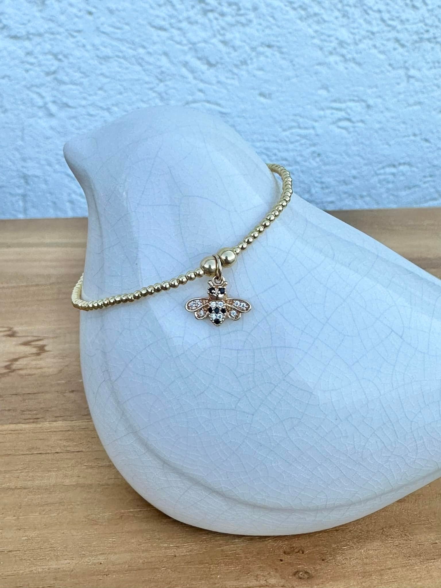 Bracelet fin or avec abeille noire