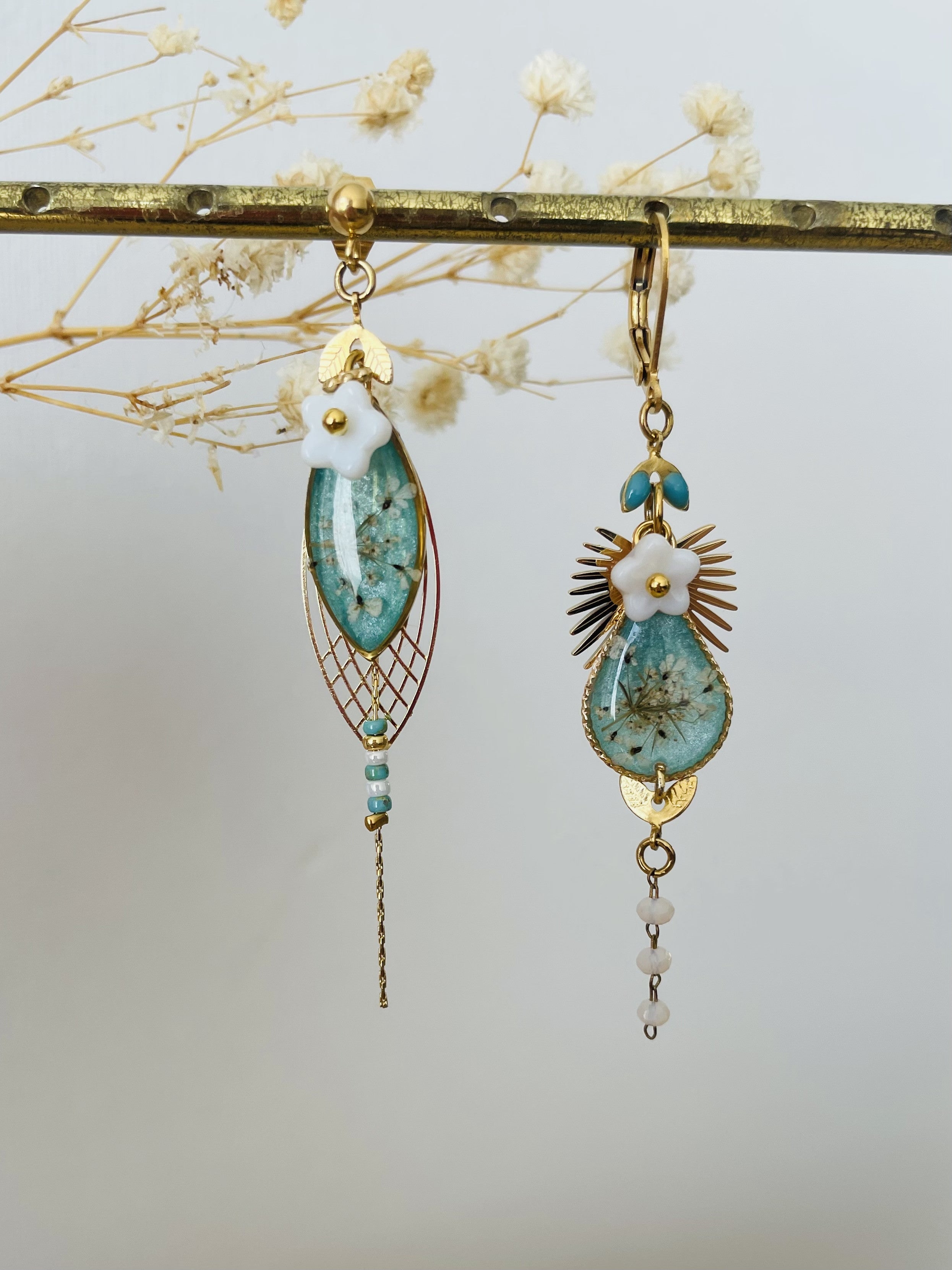 Blue asymmetrical floral earrings