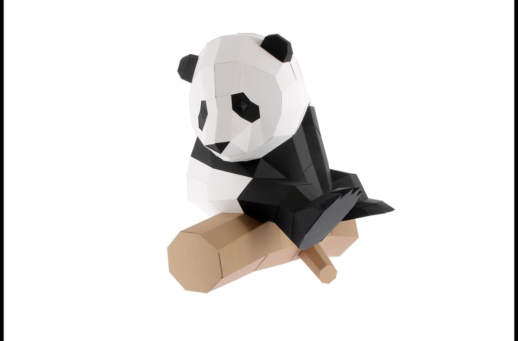 Little 3D paper panda on a branch