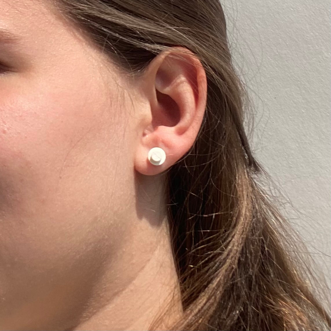 Earrings with a round Lego brick