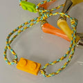 Adjustable braided yellow/green cord bracelet