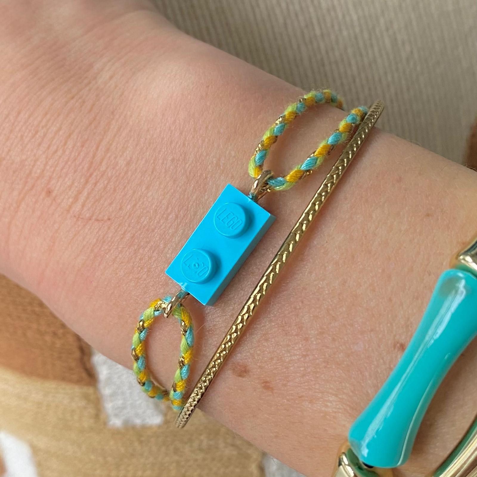 Adjustable braided yellow/green cord bracelet