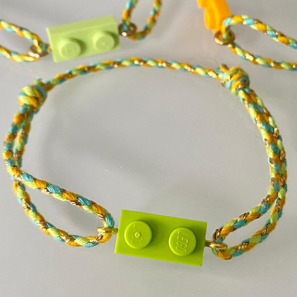 Adjustable braided yellow/green cord bracelet