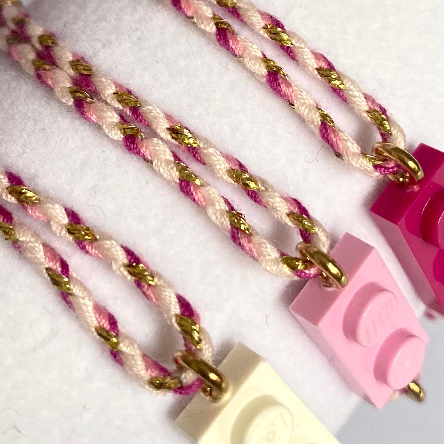Adjustable braided pink gradient cord bracelet