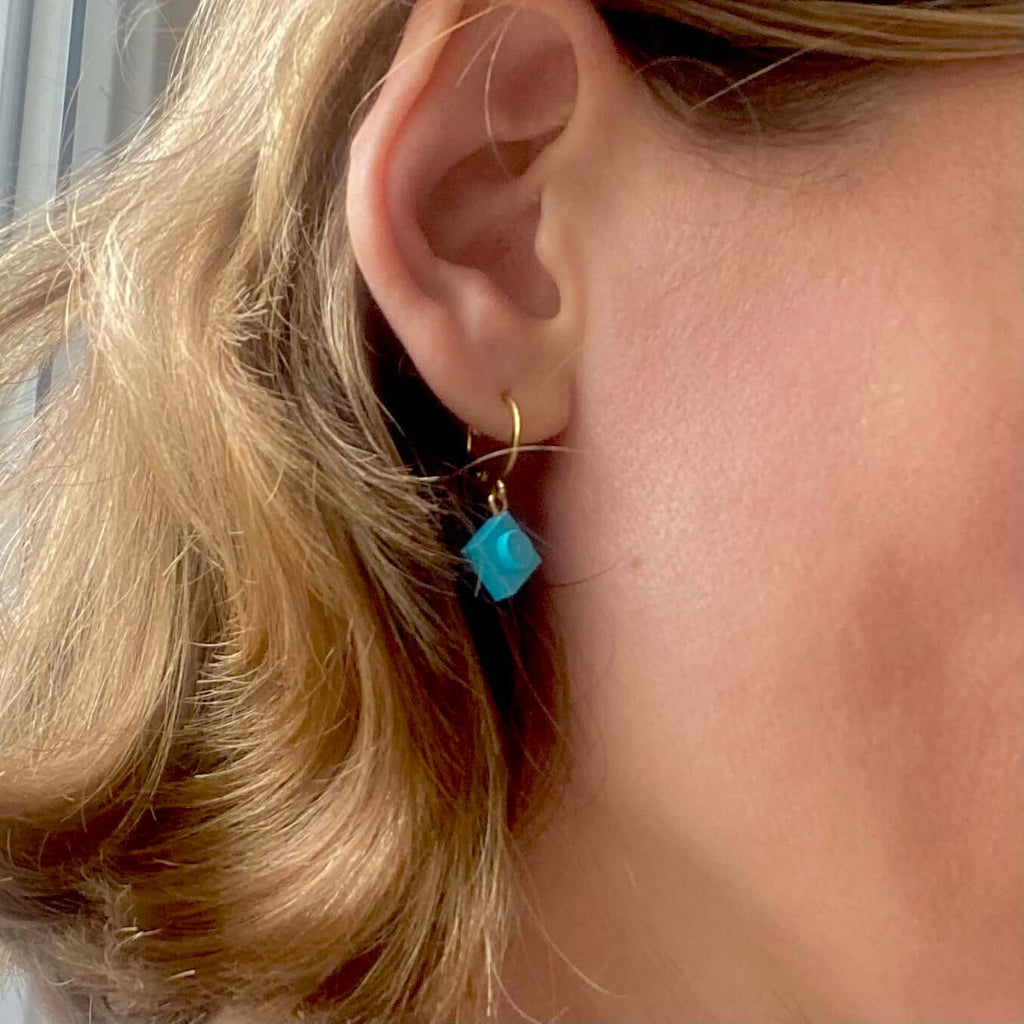 Mini stainless steel sleeper earrings with a Lego® brick