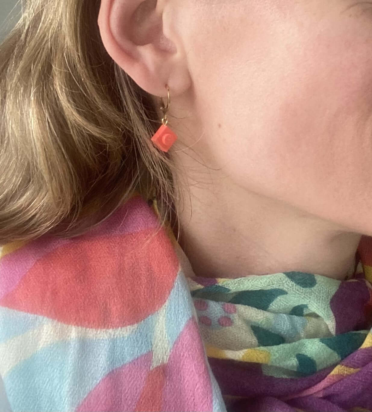Mini stainless steel sleeper earrings with a Lego® brick