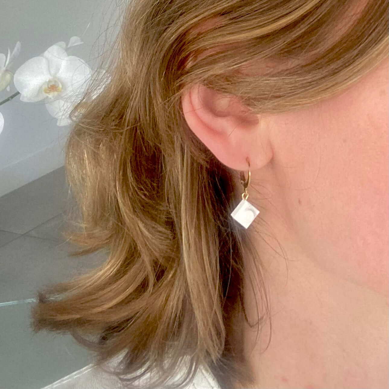 Mini stainless steel sleeper earrings with a Lego® brick