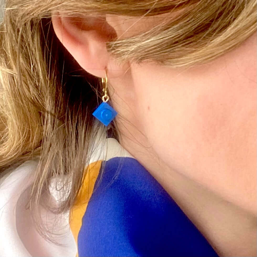 Mini stainless steel sleeper earrings with a Lego® brick