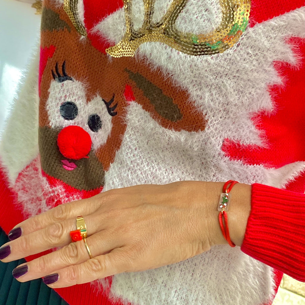 Bracelet spécial Noël avec un sucre d'orge imprimé sur une brique de Lego authentique. Le bracelet se règle avec un cordon ajustable coulissant facilement. A assortir à votre pull de Noël