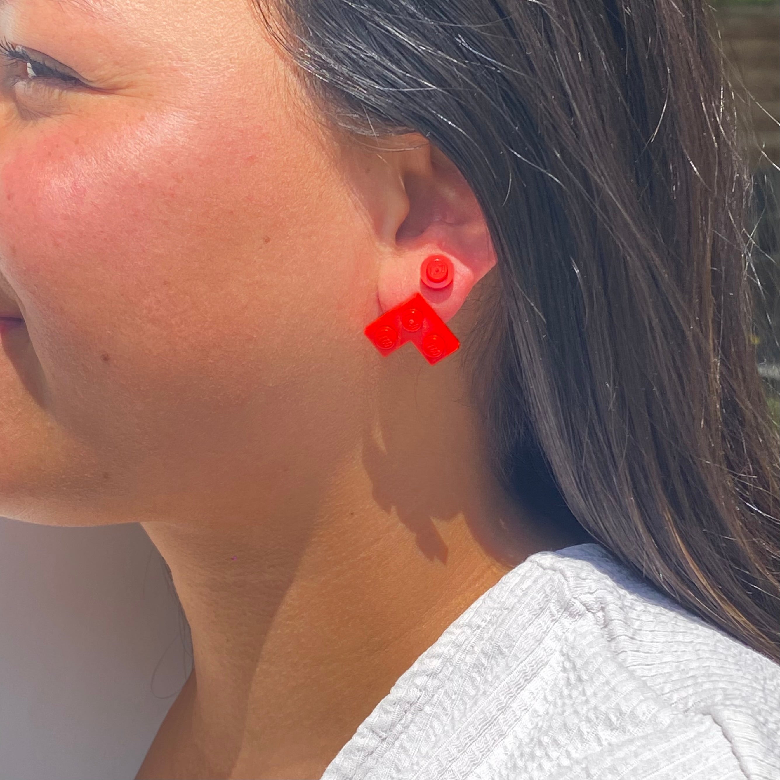 Earrings with a round Lego brick