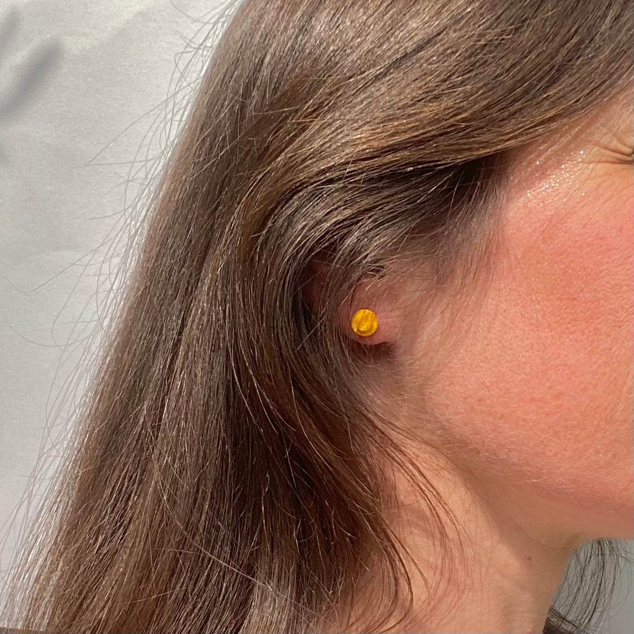 Earrings with a round Lego brick