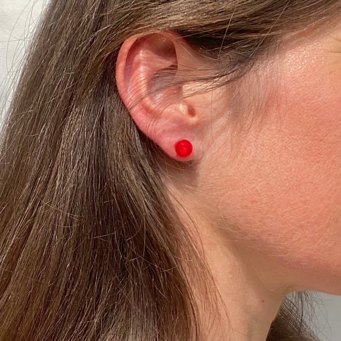 Earrings with a round Lego brick