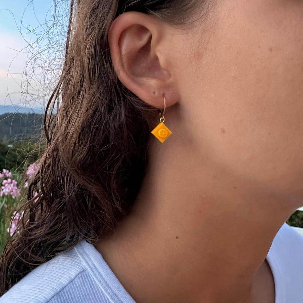Mini stainless steel sleeper earrings with a Lego® brick