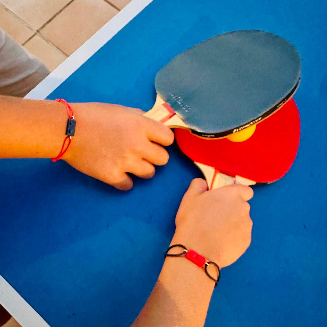 Friendship bracelet with a Lego brick and adjustable cotton cord