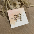 Hoop earrings & their small white hearts