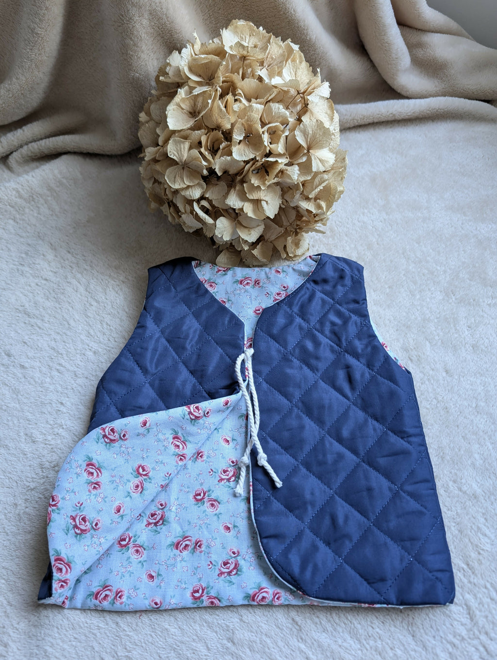 NAVY QUILTED SHEPHERD'S VEST WITH FLOWERS 18 MONTHS-3 YEARS