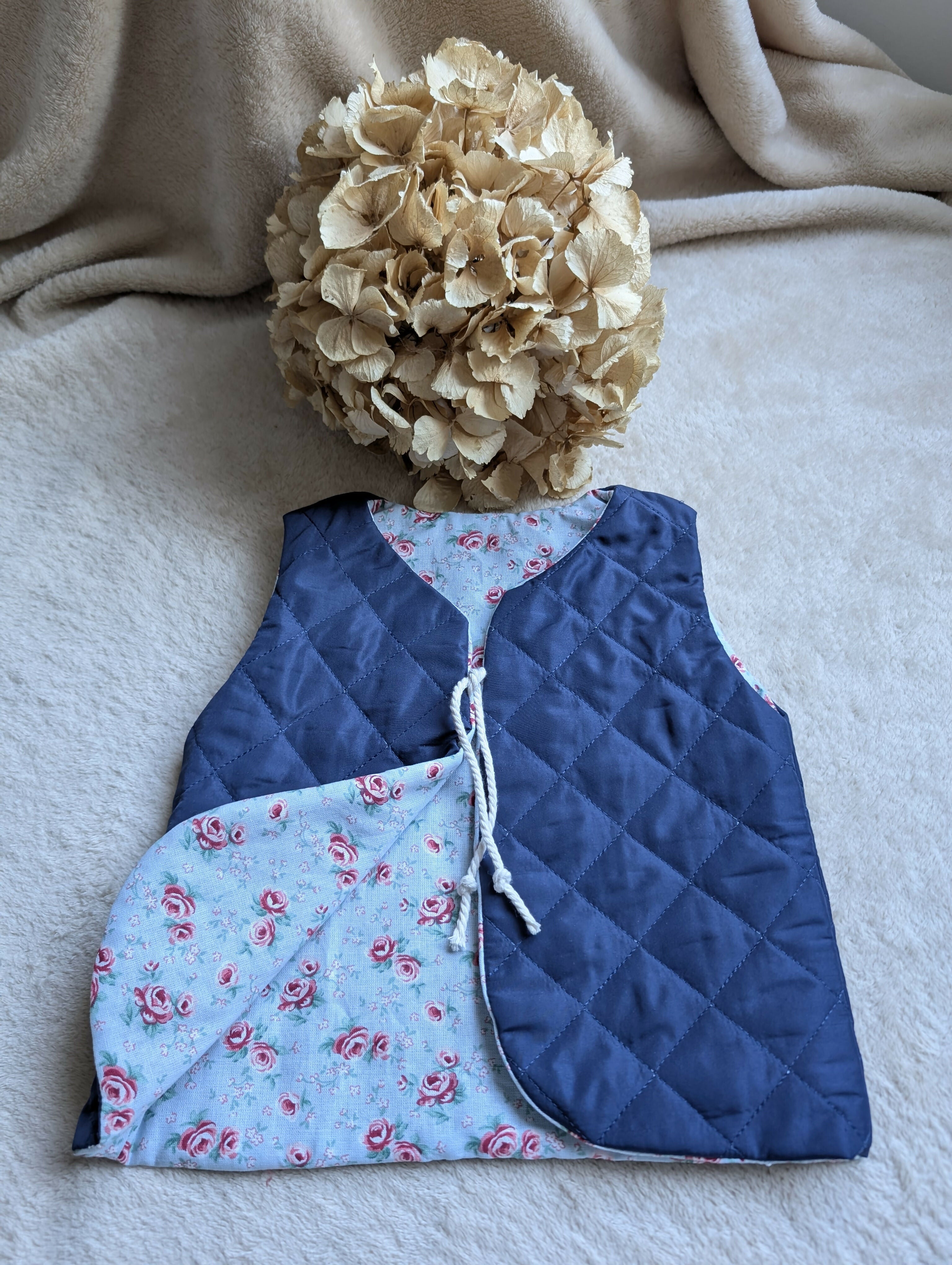 NAVY QUILTED SHEPHERD'S VEST WITH FLOWERS 18 MONTHS-3 YEARS