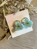 Large gold hoop earrings & large light green flowers