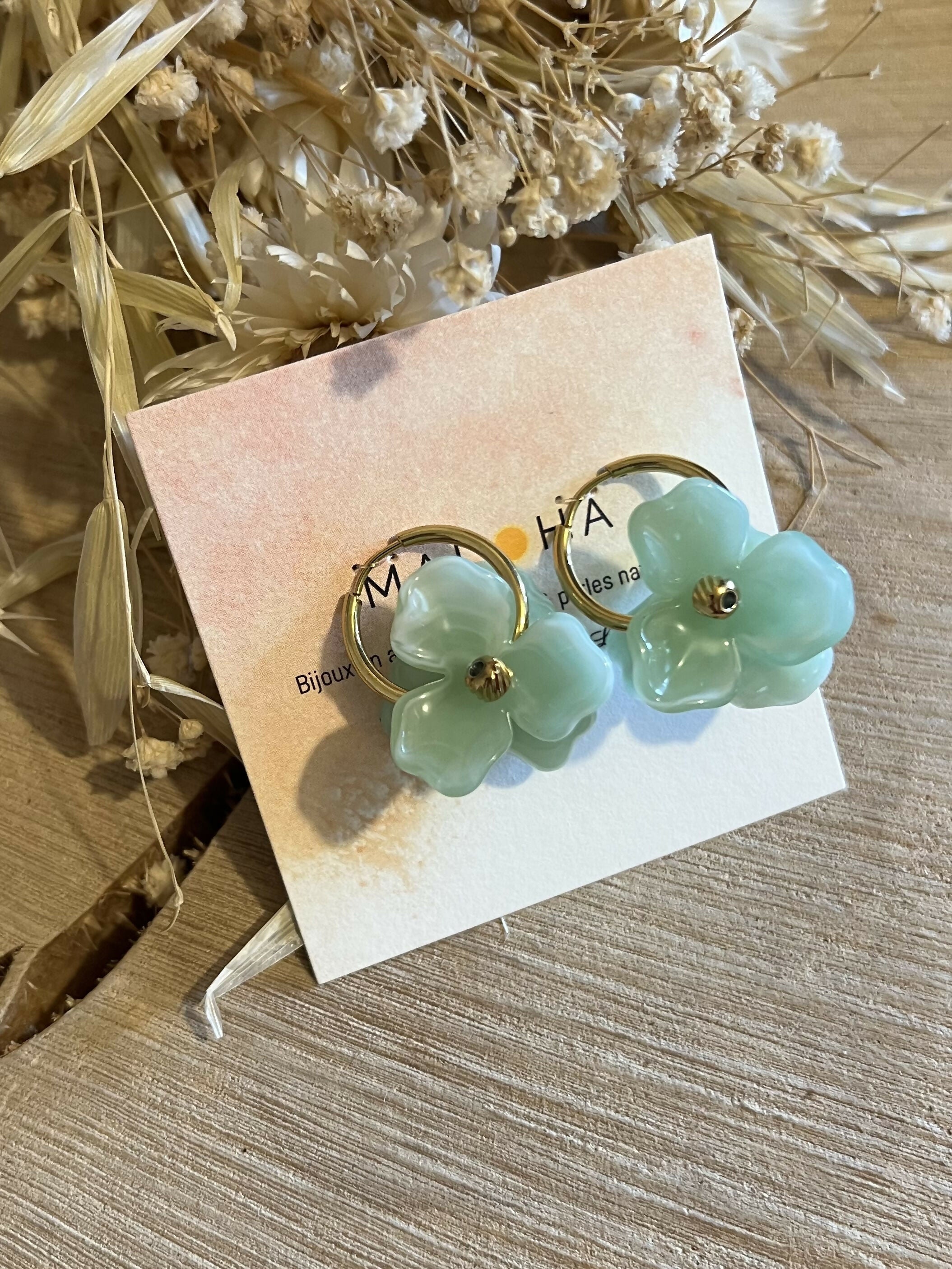 Large gold hoop earrings & large light green flowers