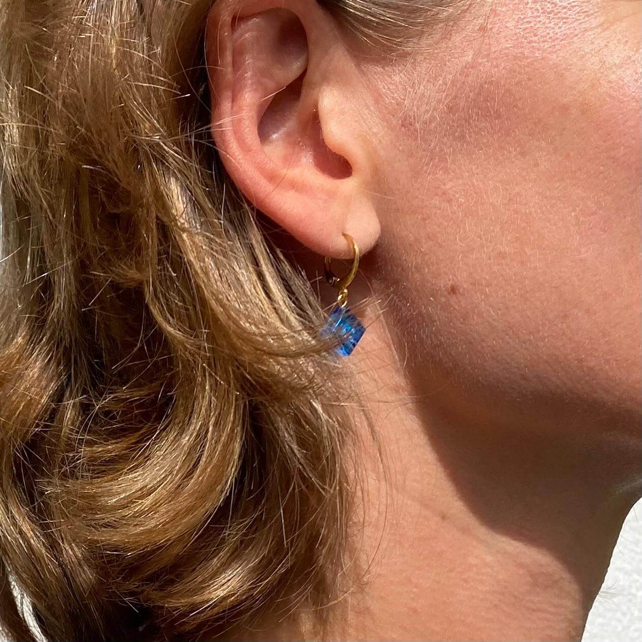 Mini stainless steel sleeper earrings with a Lego® brick