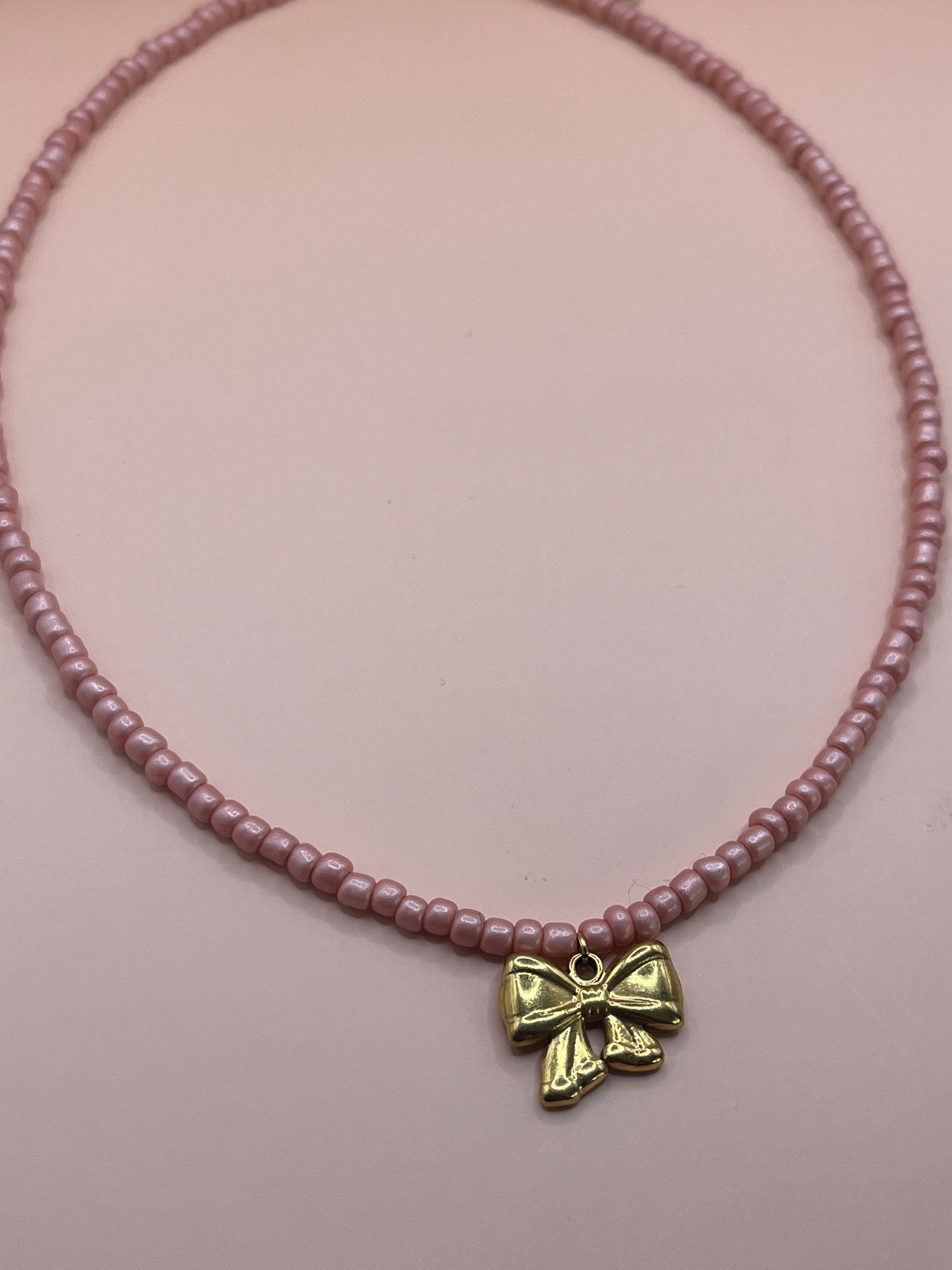 collier rose noeud