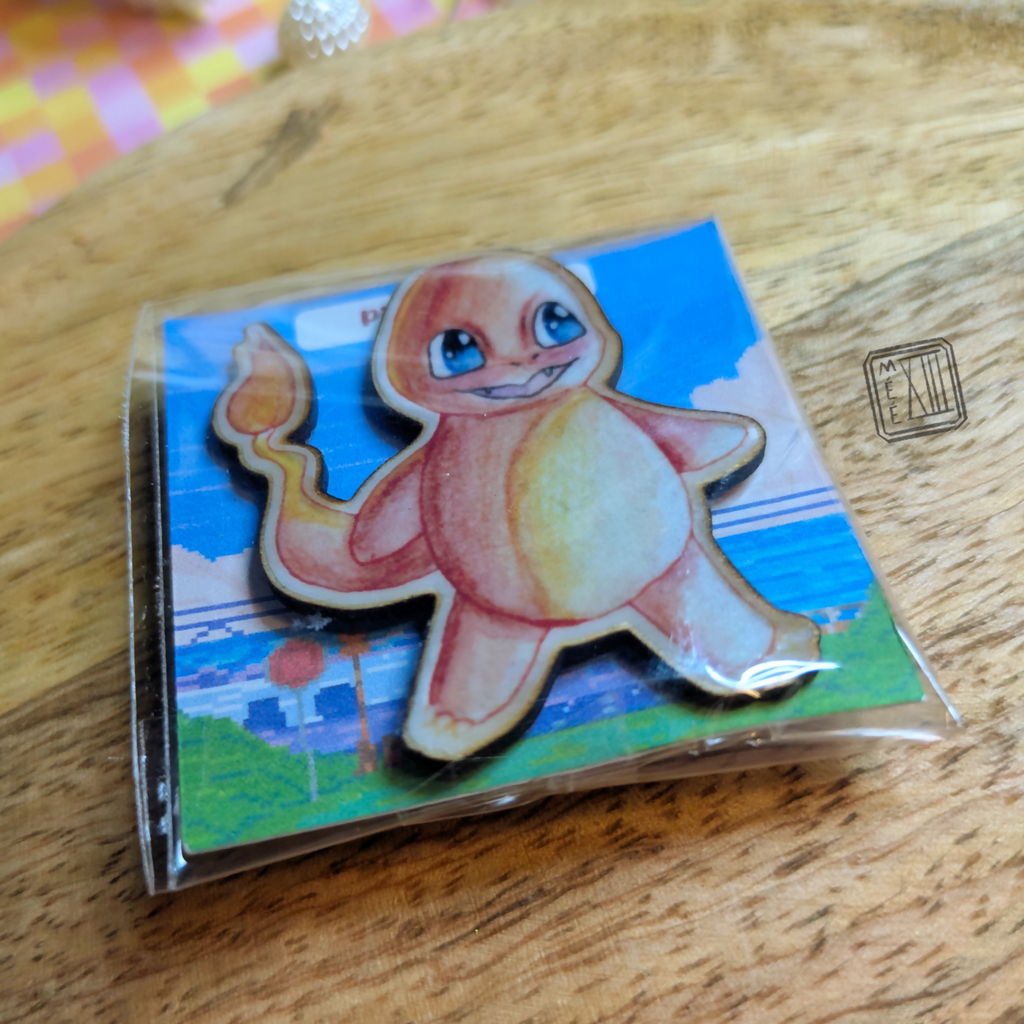 Pin's petit monstre orange