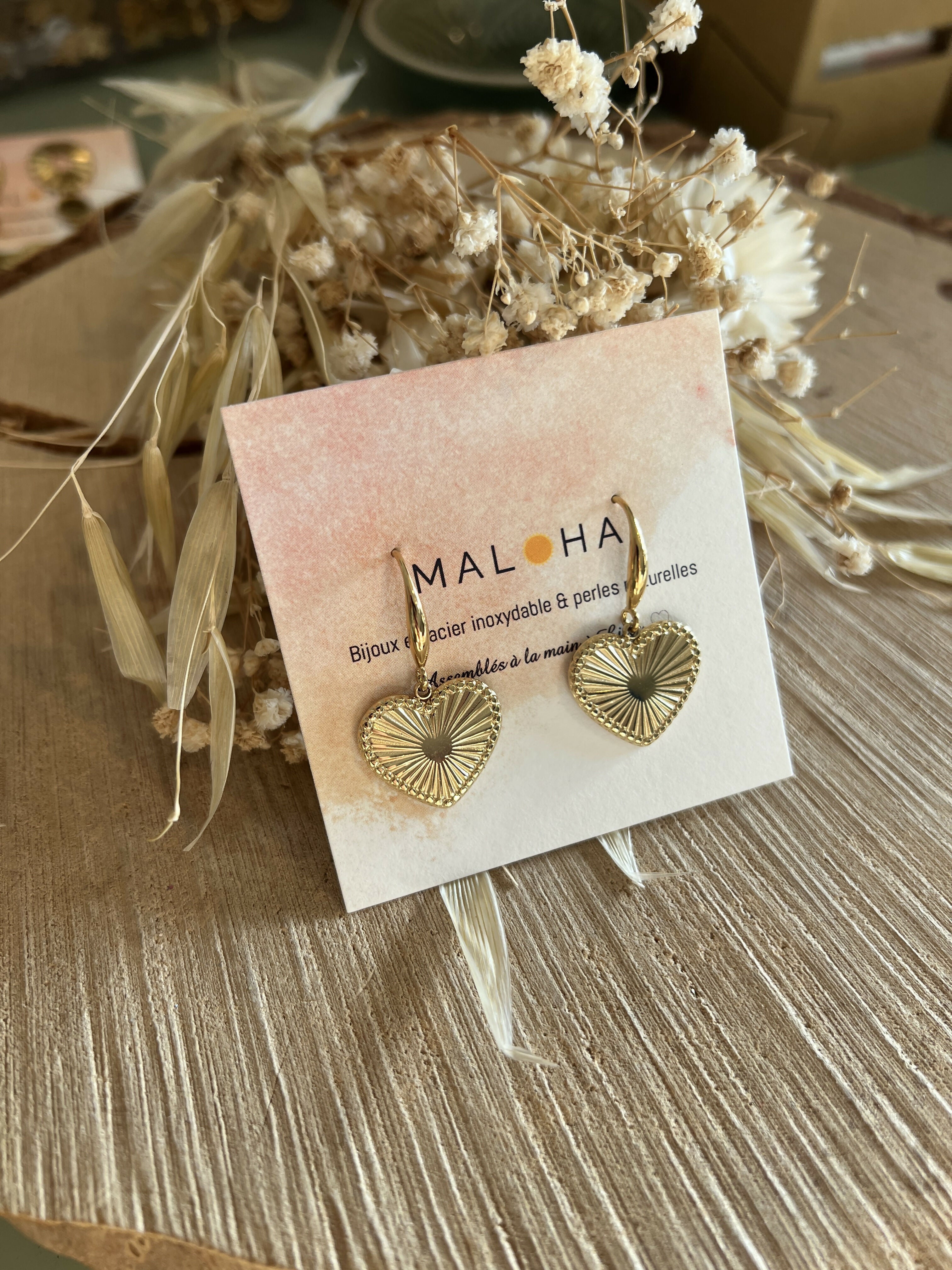 Dangling earrings, large golden hearts