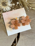 Large golden hoop earrings & large coral flowers