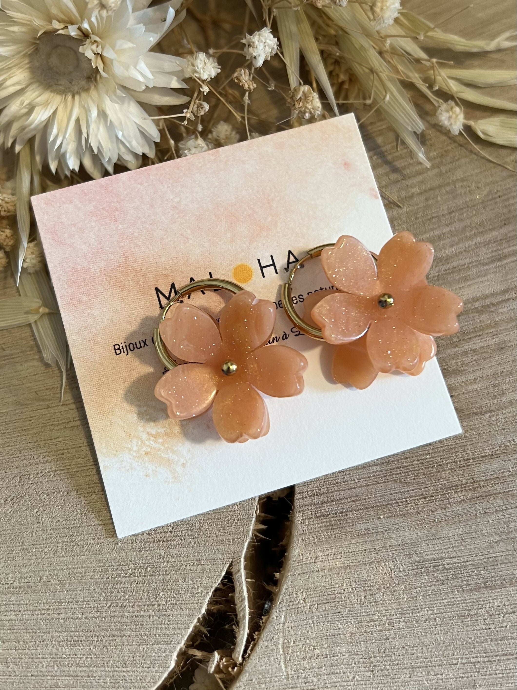 Large golden hoop earrings & large coral flowers