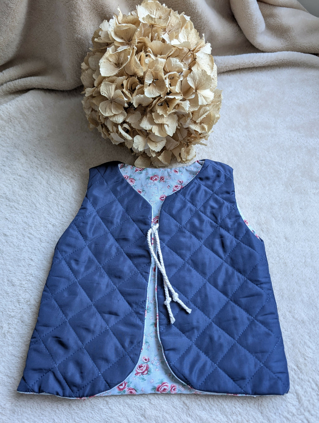 NAVY QUILTED SHEPHERD'S VEST WITH FLOWERS 18 MONTHS-3 YEARS