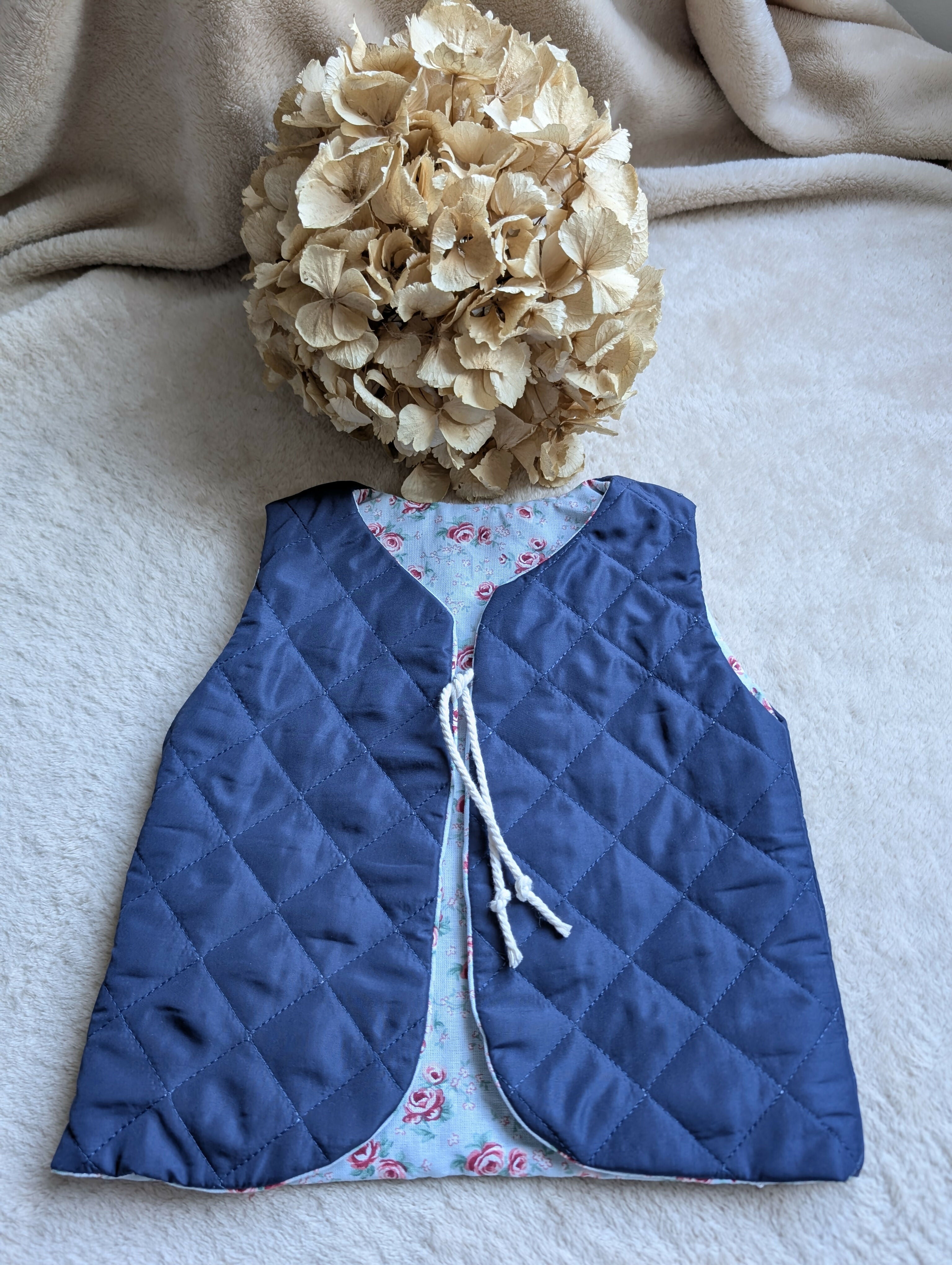 NAVY QUILTED SHEPHERD'S VEST WITH FLOWERS 18 MONTHS-3 YEARS